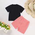 Close-up of black short sleeve t-shirt with apple applique design for toddler boys