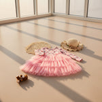 Girls princess-style tulle dress with heart print pattern and comfortable long sleeves.