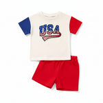 Infant baby boy 4th of July 2-piece outfit set with USA letter print color block t-shirt and matching shorts flat lay
