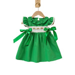 Back view of green toddler party dress showing button closure detail
