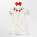 Toddler girl wearing a heart embroidered ruffle sleeve polka dot A-line dress